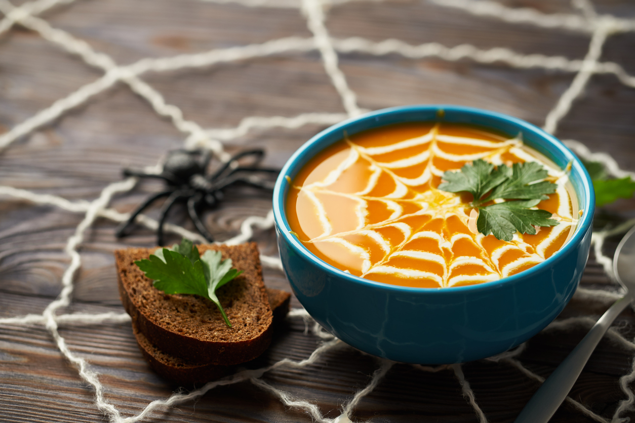 Halloween, autumn themed soup with slices of bread