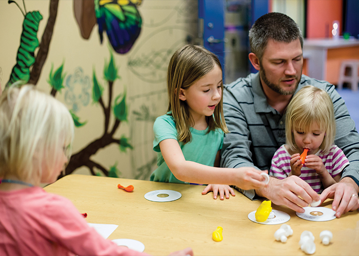 Family exploring at Mobius Discovery Center