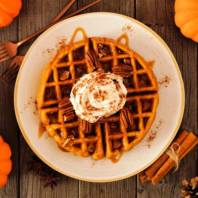 waffle with pecans, cream, and drizzle