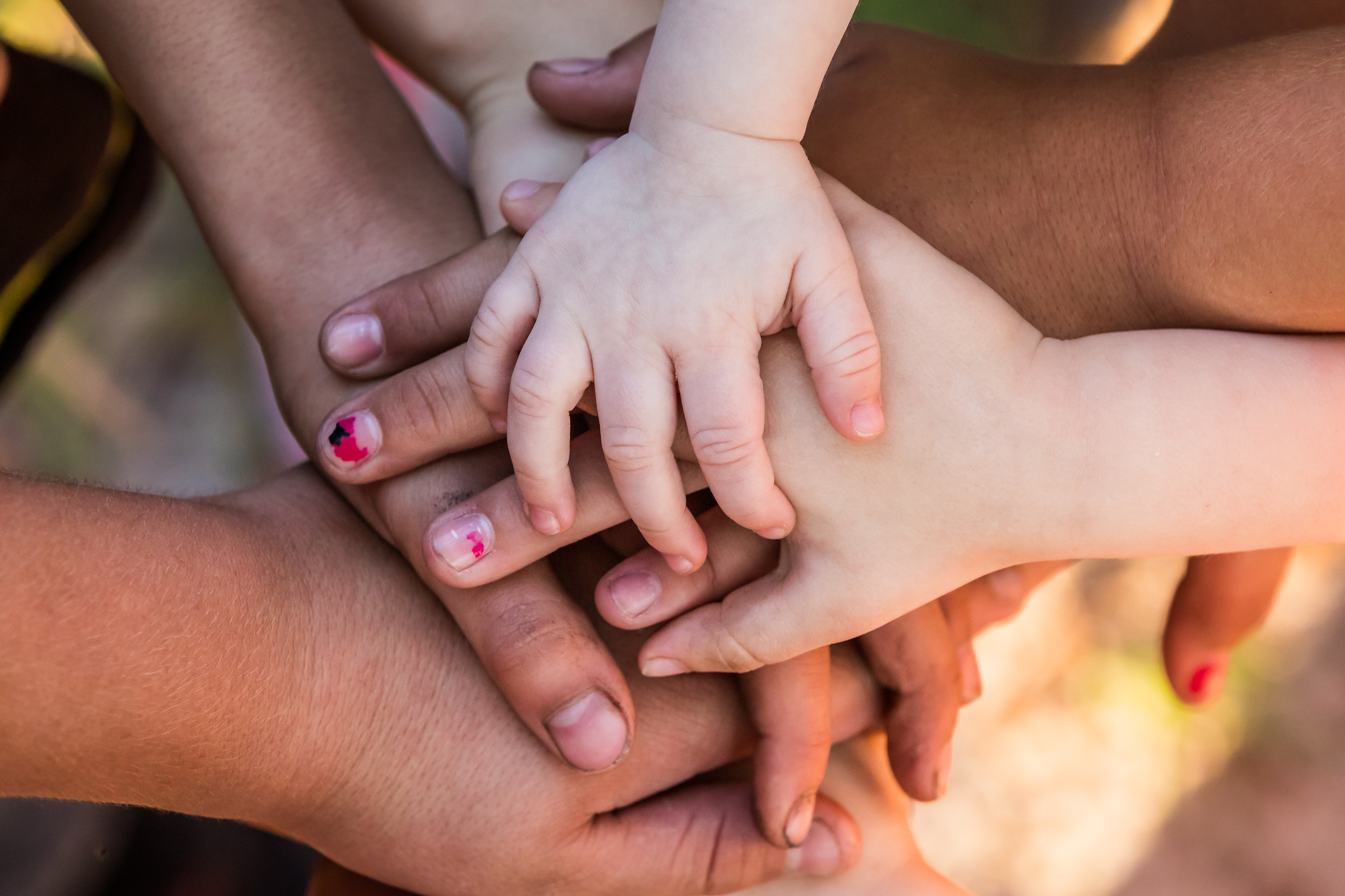 hands on top of each other on solidarity