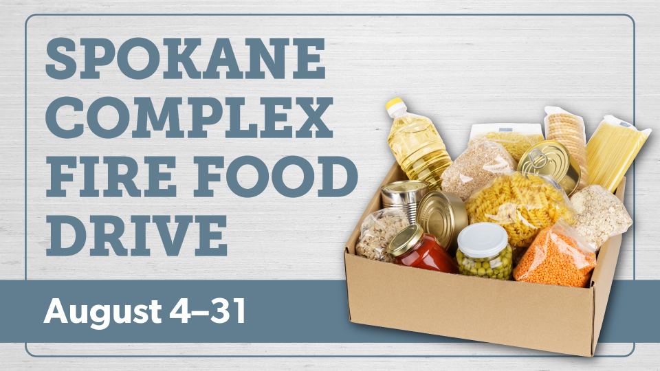 Box of nonperishable food items for Spokane Complex Fire food drive accepting donations from August 4 to 31 at SCLD libraries.